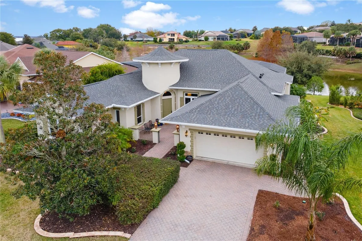 Property Slideshow image 1 of 65 | 38912 harborwoods pl, Lady Lake, FL, 32159