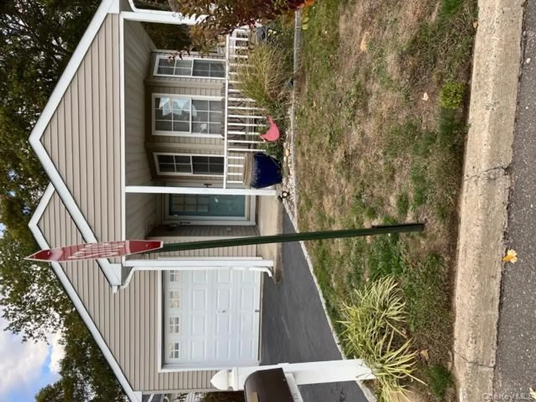 Property Slideshow image 1 of 18 | 426 village cir, Manorville, NY, 11949