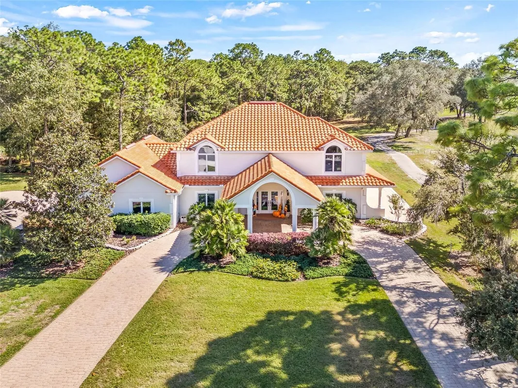 Property Slideshow image 1 of 73 | 5198 legend hills ln, Spring Hill, FL, 34609
