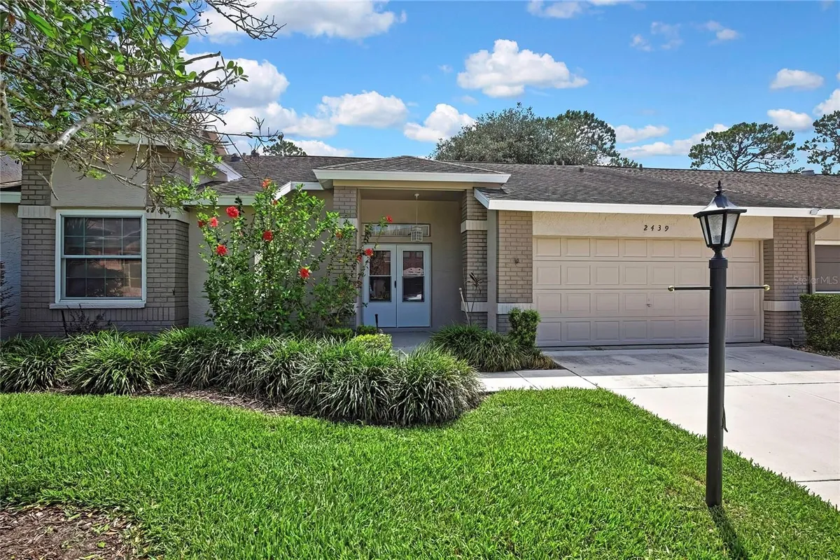 Property Slideshow image 1 of 29 | 2439 hidden trail dr, Spring Hill, FL, 34606