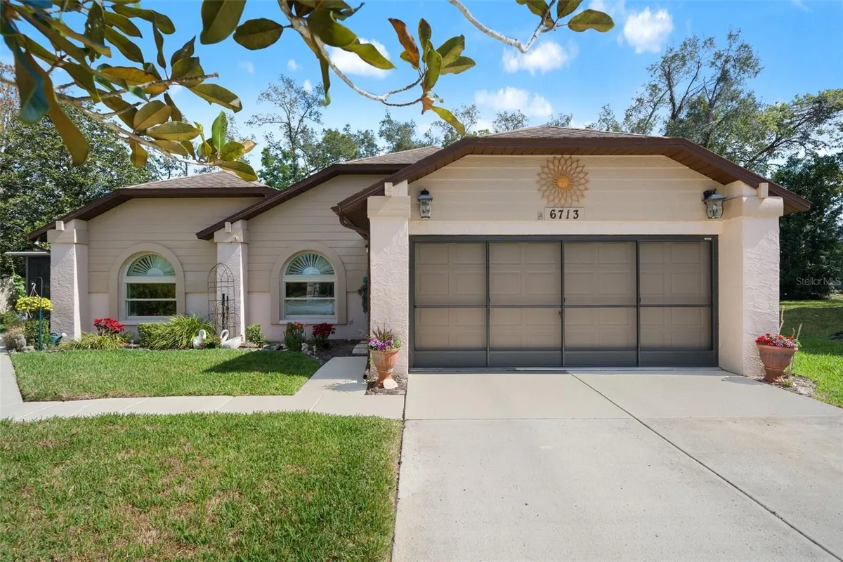 Property Slideshow image 1 of 65 | 6713 oak cluster cir, Spring Hill, FL, 34606