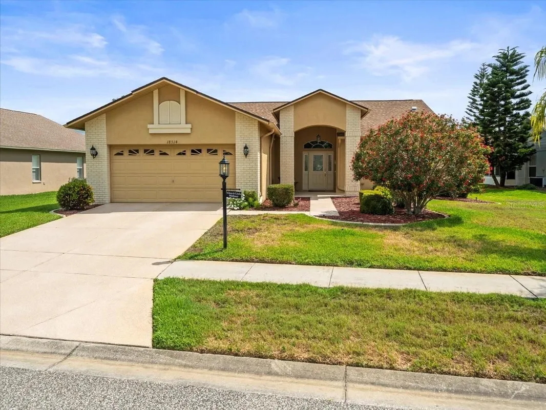 Property Slideshow image 1 of 57 | 18514 hidden pines way, Hudson, FL, 34667